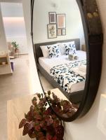 A bed or beds in a room at Ivy, 4 minutes from the sea