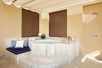 a bathroom with a jacuzzi tub in a room at Jumeirah Mina Al Salam Dubai in Dubai