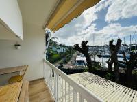 a balcony with a view of a marina at Studio Fresh&amp;Cosy Trois-Ilets - 3 étoiles-Hotel Carayou in Les Trois-Îlets