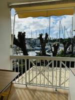 a balcony with a view of a marina with boats at Studio Fresh&amp;Cosy Trois-Ilets - 3 étoiles-Hotel Carayou in Les Trois-Îlets