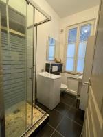 a bathroom with a shower and a sink and a toilet at Le Versant de la Cathédrale - Parking - Autonomous in Chartres