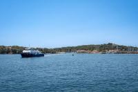 a boat in the middle of a large body of water at Hôtel Helios &amp; SPA - Ile des Embiez in Six-Fours-les-Plages