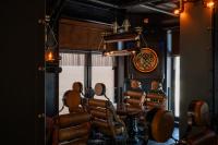 a dining room with a table and some chairs at 4 Strony Apartamenty w Wodnej Wieży in Pszczyna