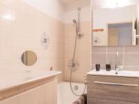 a bathroom with a shower and a sink and a tub at Appartement Le Monêtier-les-Bains, 2 pièces, 6 personnes - FR-1-330F-35 in Le Monêtier-les-Bains