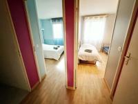 a view of a room with a bedroom and a bed at Disney et Paris pour 4 personnes RER A in Champs-sur-Marne