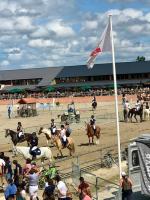 a group of people riding horses in an arena at LE CAMELIA in Saint-Viâtre