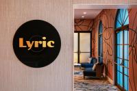 a lobby of a hotel with a sign on a wall at Hotel Dena, Pasadena Los Angeles, a Tribute Portfolio Hotel in Pasadena