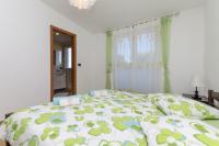 Posteľ alebo postele v izbe v ubytovaní Apartments Sinisa