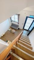 a view of a staircase with a couch and windows at Sun B&amp;B in Taitung City