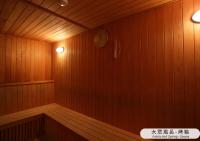 a room with a sauna with a clock on the wall at The Gaia Hotel - Taipei in Taipei