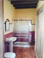 a bathroom with a shower and a toilet and a sink at Apartamentos Daper in Facinas