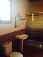 a bathroom with a toilet and a sink and a shower at Apartamentos Daper in Facinas