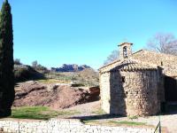 an old stone building with a tower on a hill at Apartment Domaine de Roquebrune by Interhome in La Rouviere