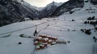 an aerial view of a ski resort in the snow at Bergdorf Hotel Zaglgut in Kaprun