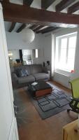 a living room with a couch and a table at Beau studio PARIS beau quartier cœur de Paris 5e in Paris