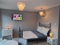 Posteľ alebo postele v izbe v ubytovaní Apartament Kryształowy