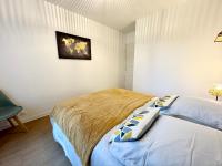 Katil atau katil-katil dalam bilik di Grand T2 Cocooning - 50m des plages