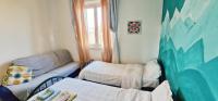 Posteľ alebo postele v izbe v ubytovaní A dieci minuti dal centro - accogliente spazioso
