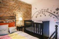 Postel nebo postele na pokoji v ubytování Apartmán V medvědím brlohu