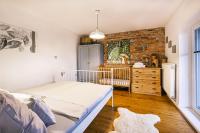 Postel nebo postele na pokoji v ubytování Apartmán V medvědím brlohu