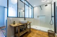 a bathroom with a sink and a shower at ALOE KEYWEEK Architect Apartment with terrace and garage Biarritz in Biarritz