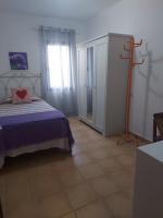 Postel nebo postele na pokoji v ubytování villa Mimosa