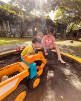 a boy and a girl playing with a toy truck at Follow Me designed B&amp;B in Dongshan