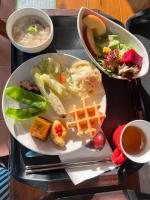 a tray with two plates of food and a bowl of soup at Zhong Ming Ju Taoyi Fang in Fanlu