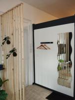 a white door in a room with a closet at Le Studio de la Seine in Elbeuf