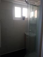 a bathroom with a shower and a window at Le Studio de la Seine in Elbeuf