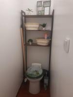 a small bathroom with a toilet in a room at Le Studio de la Seine in Elbeuf