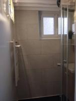a bathroom with a shower and a window at Le Studio de la Seine in Elbeuf