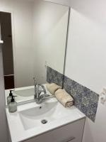 a bathroom sink with a large mirror above it at La maison des Petits Robins in Livron-sur-Drôme