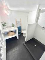 a small bathroom with a sink and a toilet at Maison familiale avec vue tour Eiffel in Suresnes