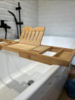 a wooden cutting board sitting on top of a bath tub at Maison familiale avec vue tour Eiffel in Suresnes