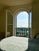a bedroom with a view of the eiffel tower at Maison familiale avec vue tour Eiffel in Suresnes