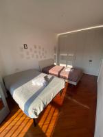 Posteľ alebo postele v izbe v ubytovaní VILLA FENIX MILANO