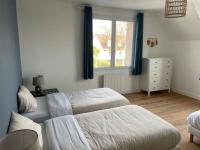 Cama o camas de una habitaci&oacute;n en La Maison du Bonheur