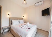 Postel nebo postele na pokoji v ubytování Ruellia Luxury Apartments
