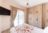 Postel nebo postele na pokoji v ubytování Ruellia Luxury Apartments