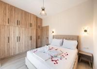 Postel nebo postele na pokoji v ubytování Ruellia Luxury Apartments