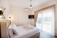Postel nebo postele na pokoji v ubytování Ruellia Luxury Apartments