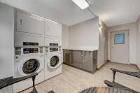a laundry room with a washer and dryer at Bridger Inn Hotel Downtown in Las Vegas