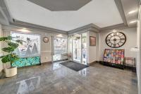 a large room with a large clock on the wall at Bridger Inn Hotel Downtown in Las Vegas