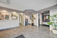 a lobby of a pharmacy with potted plants at Bridger Inn Hotel Downtown in Las Vegas