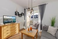 TV a/nebo společenská místnost v ubytování Apartment-Residenz Ostseestrand Apartment-Residenz Ostseestrand 21