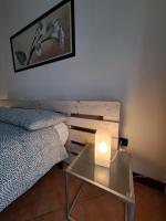 A bed or beds in a room at Casa di Gabry