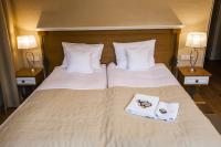 Posteľ alebo postele v izbe v ubytovaní Hotel Alhambra