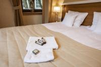 Posteľ alebo postele v izbe v ubytovaní Hotel Alhambra