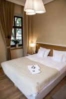 Posteľ alebo postele v izbe v ubytovaní Hotel Alhambra